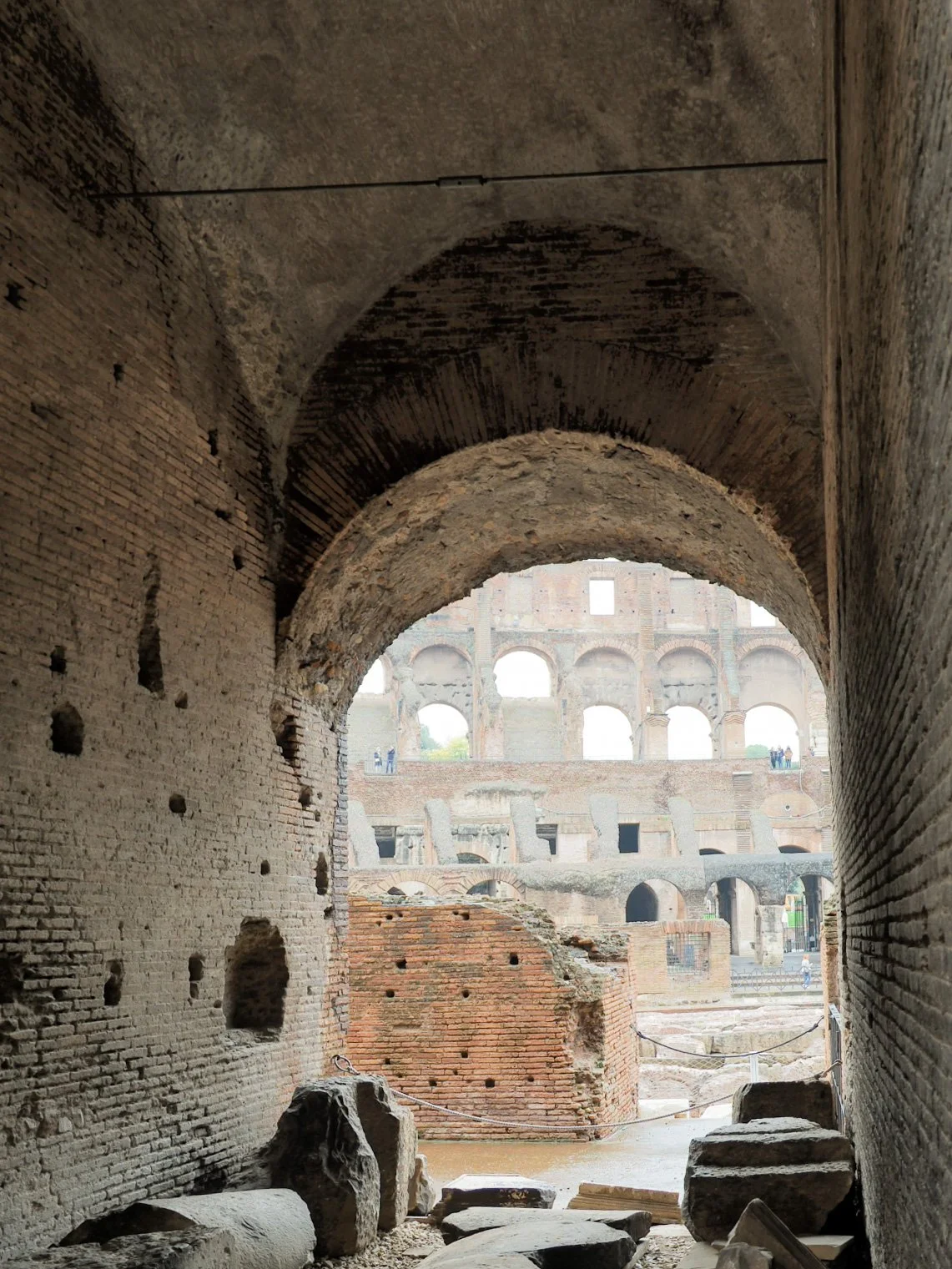 Inside view of the Colosseum with visible arches and stone ruins
