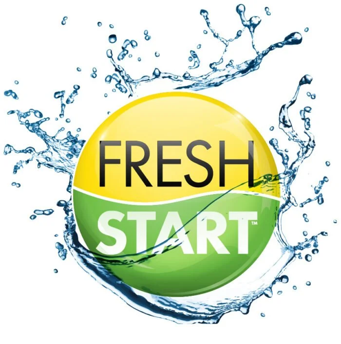 A circular logo with the words "FRESH START" in bold, black and white letters, surrounded by splashing water. This is TechMist's slogan.