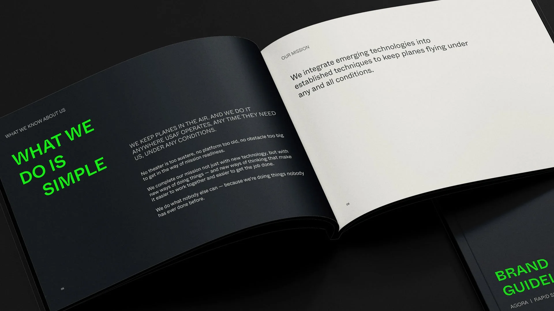 Open business magazine showing pages with mission statement about integrating emerging technologies into established techniques for flying planes, with bold green title on black background and white text on white background.