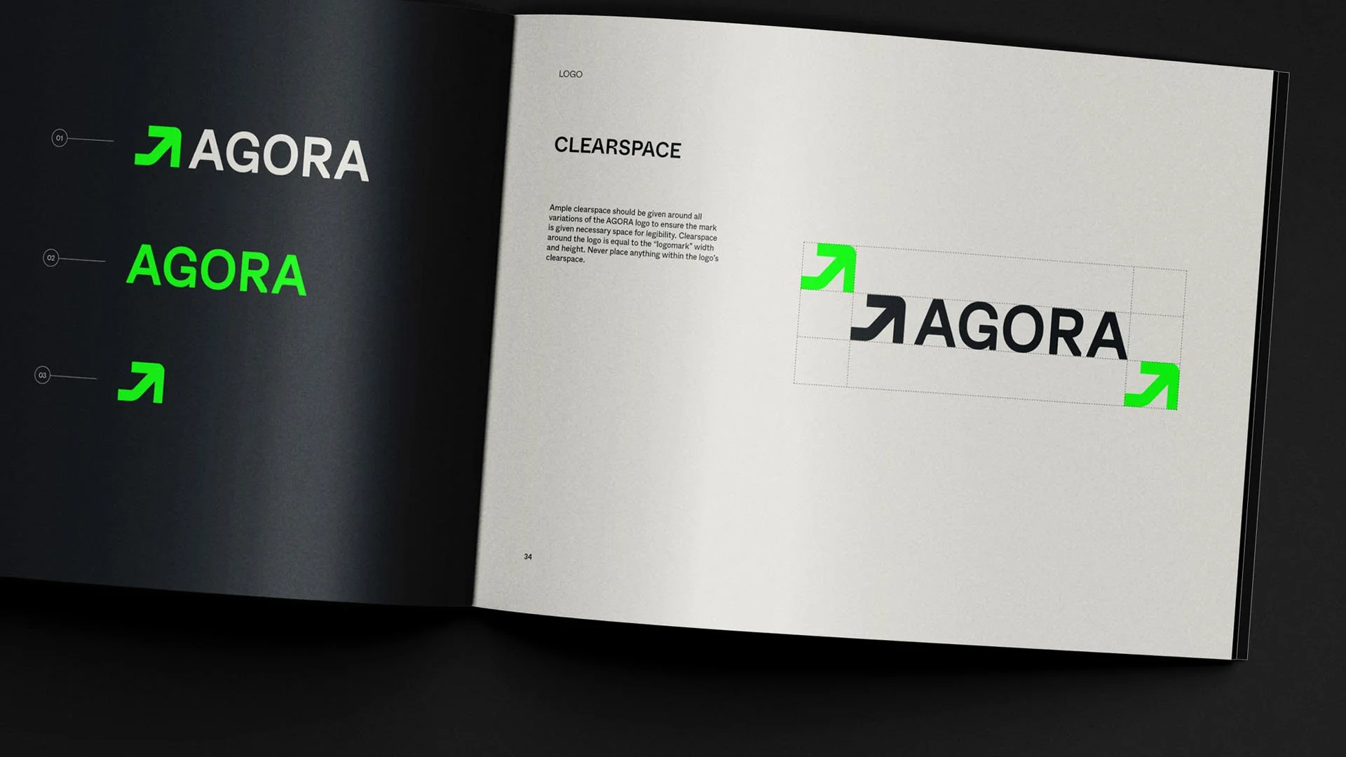 Open design manual showing logo placement guidelines for the word 'AGORA' in black uppercase letters, with green arrows indicating safe margins and clear space around the logo.