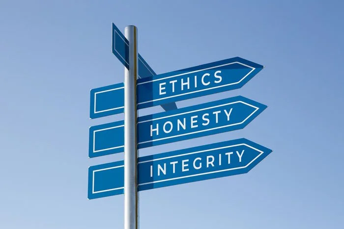 road sign indicating the direction for "Ethics, Honesty, Integrity"