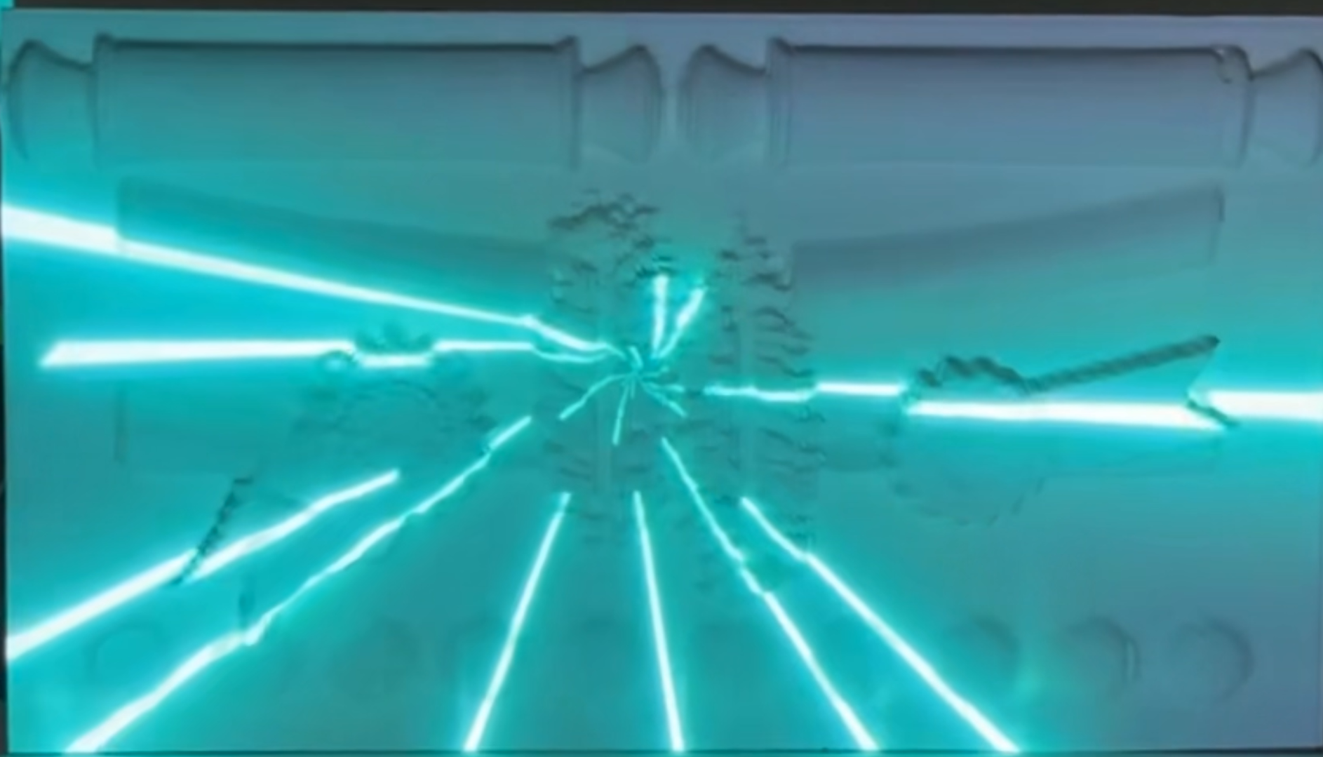 Projection of a turquoise starburst pattern over a white sculptural relief.