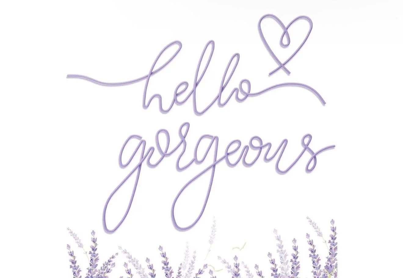 A white background featuring a neon-style purple sign that says 'hello gorgeous' with a heart above the word 'hello'. Below, there are illustrations of lavender flowers. Kara will welcome you with a warm welcoming.