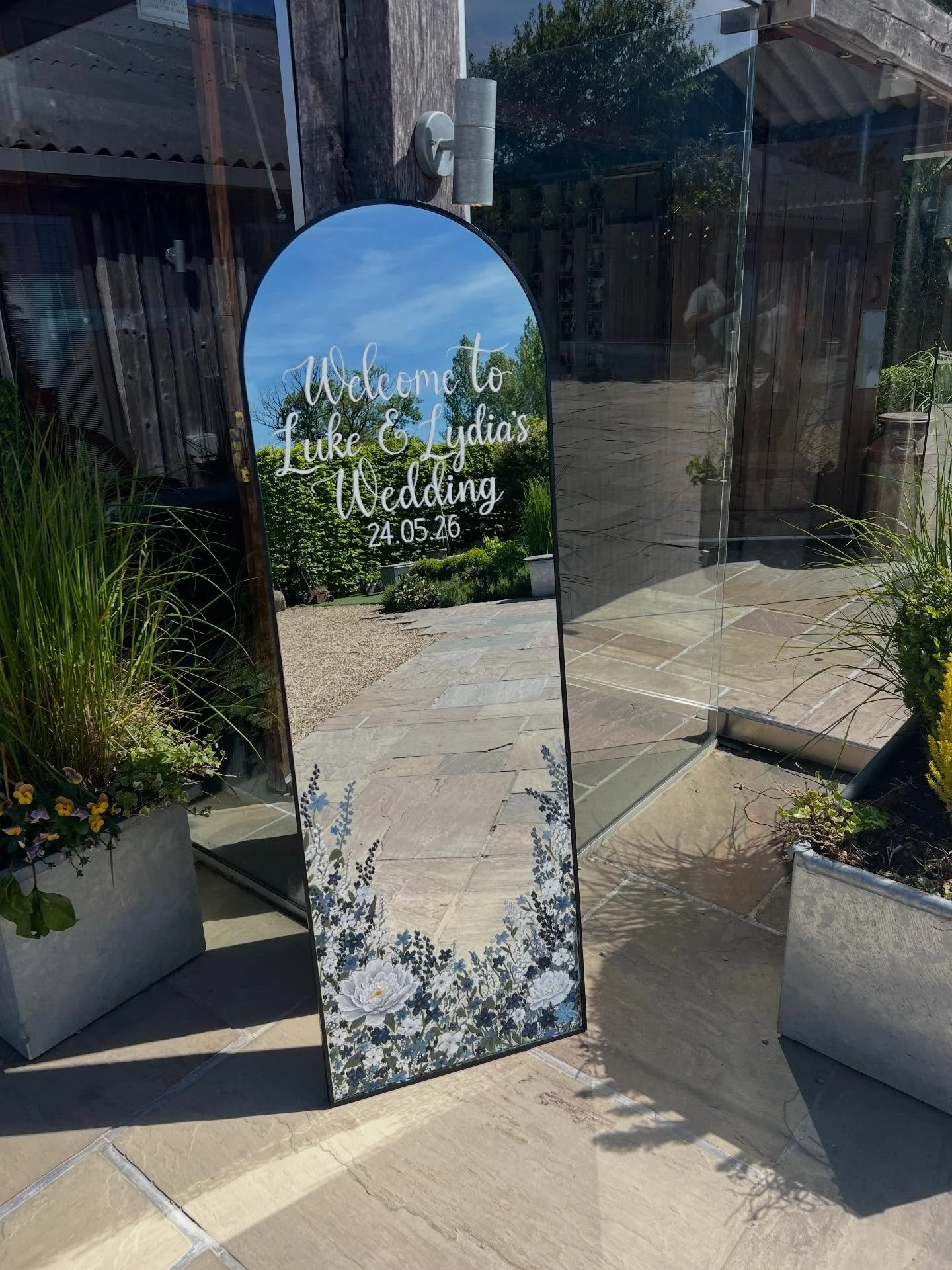 Hand painted wedding mirror for Luke &amp; Lydia ♡

Loved getting to see it all set up at the venue after weeks of painting all the little details ✨

#weddingmirror #weddingsignage #handpainted #weddingdecor #customsignage