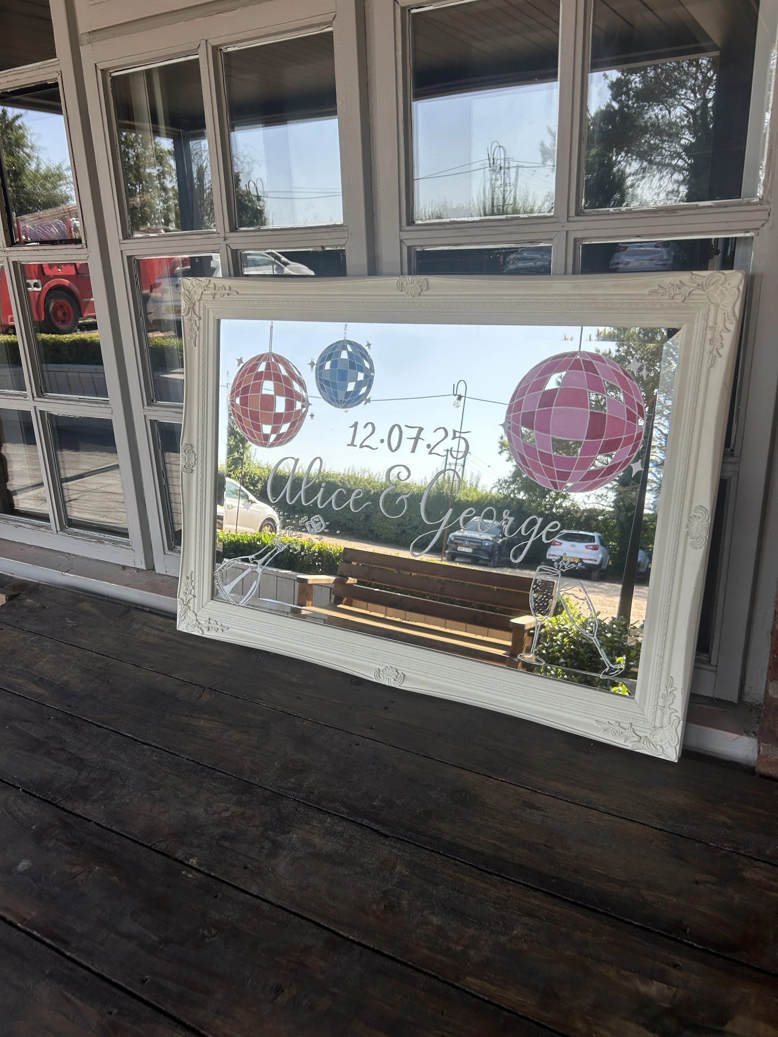 Personalised landscape mirror with disco ball and champagne details
