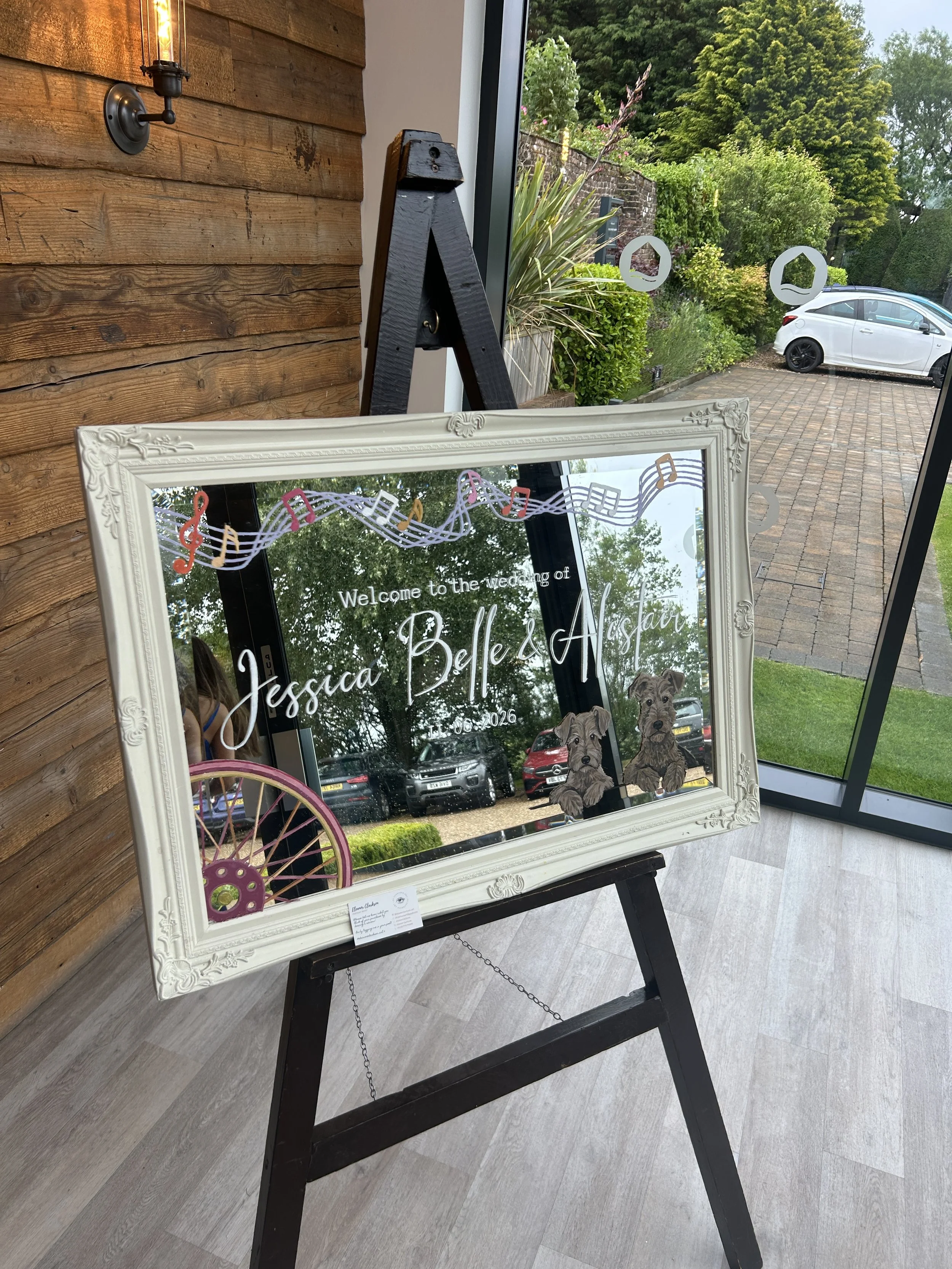 Personalised landscape mirror with dog, bike and music details