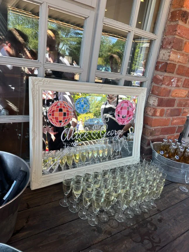 Personalised landscape mirror with disco ball and champagne details