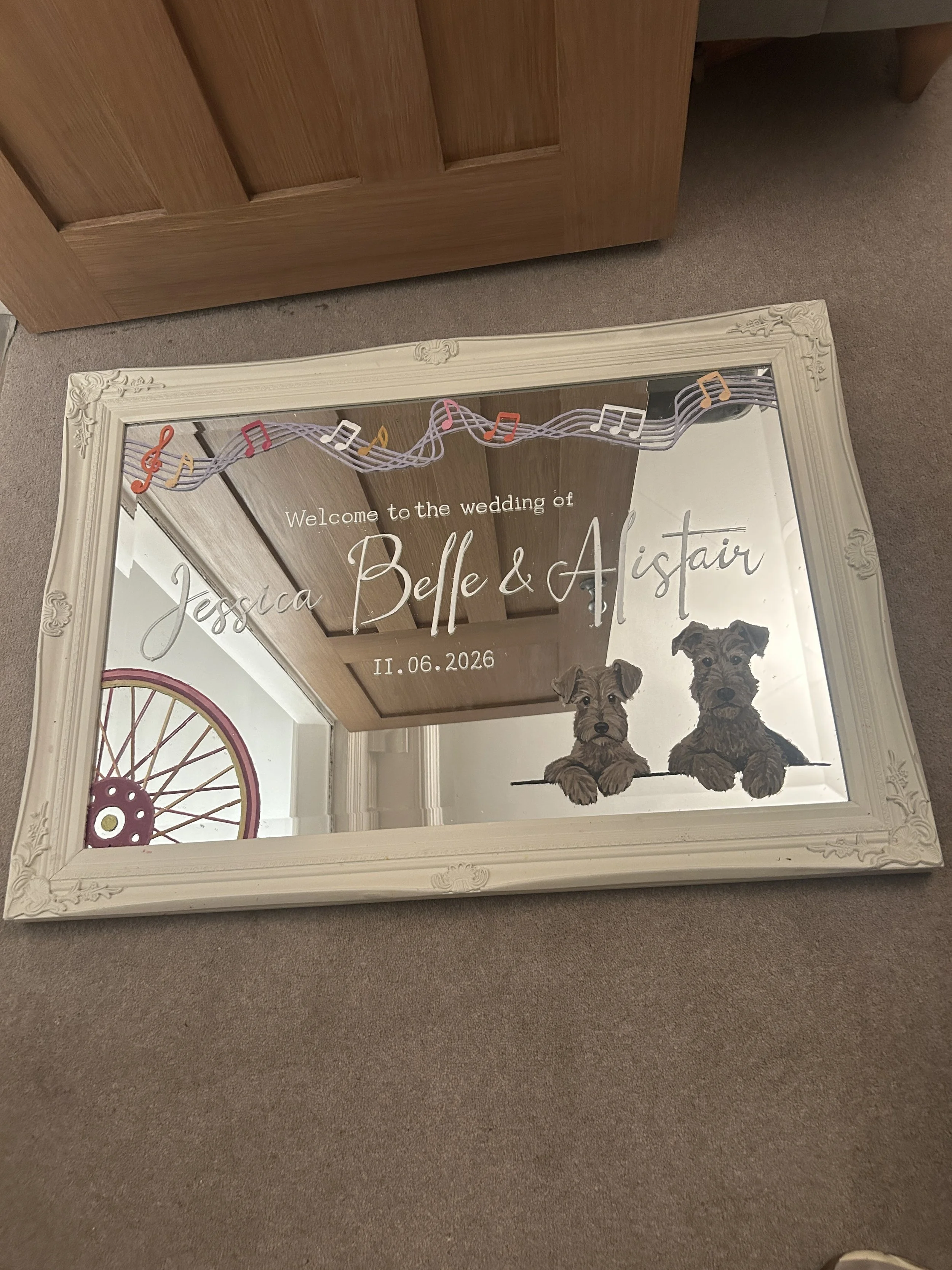 Personalised landscape mirror with dog, bike and music details