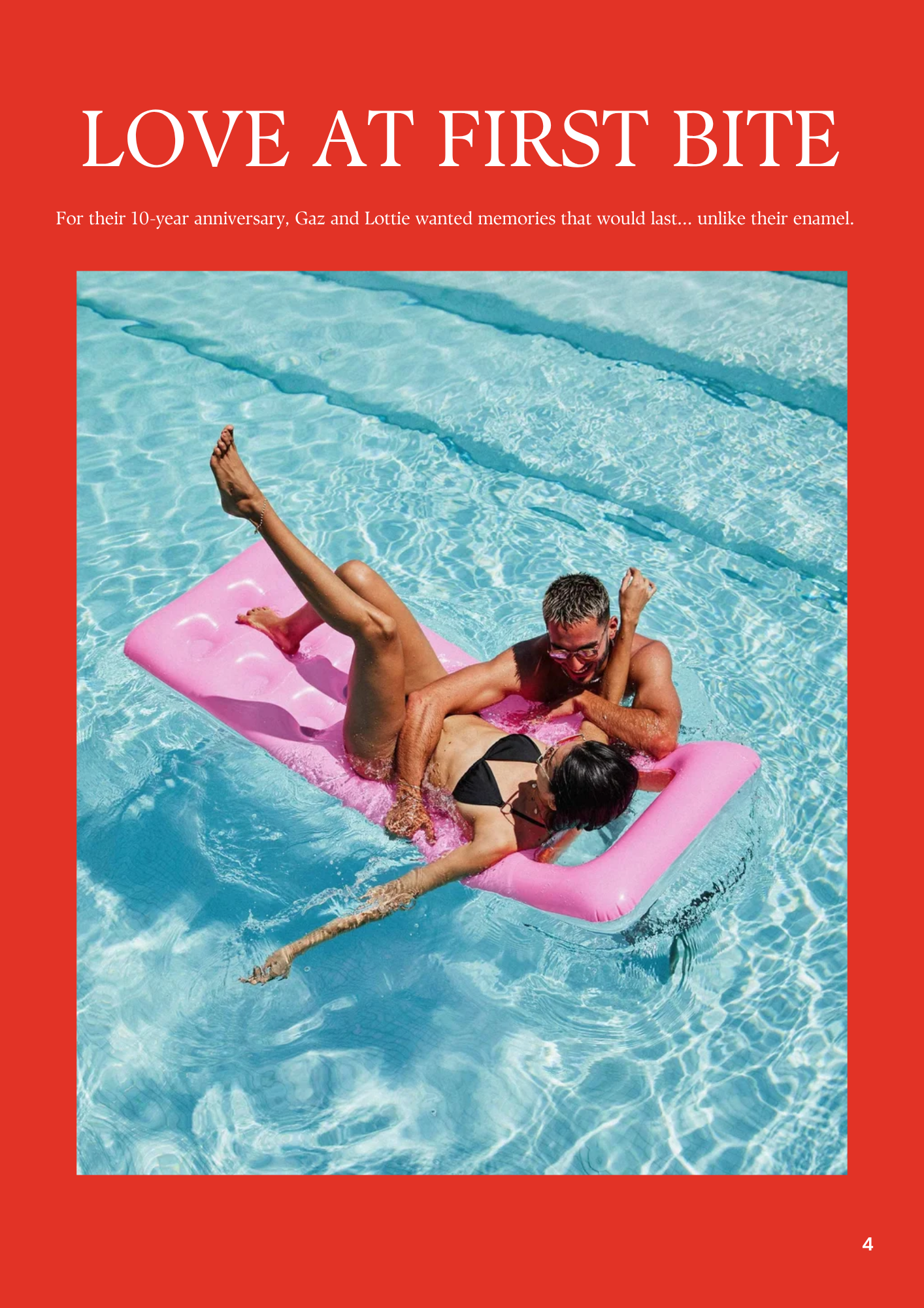 Two people, a man and a woman, are swimming and playing on a pink float in a bright blue swimming pool. They seem to be enjoying themselves, with the man holding the woman and both laughing.
