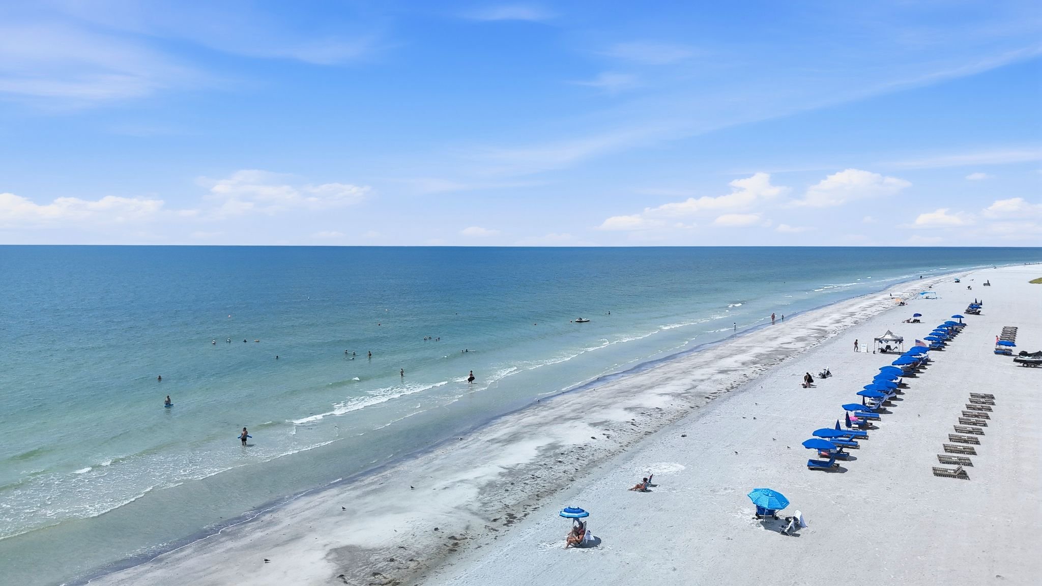 Aerial view of the white sand beach and Gulf shoreline along Gulf Blvd, North Redington Beach
