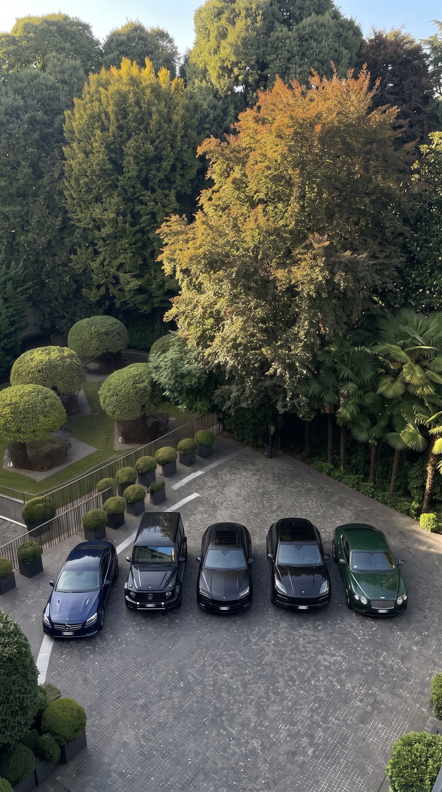 Luxury vehicle fleet including Range Rovers and a Mercedes G-Wagon parked at a private estate