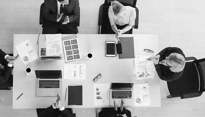 Business leaders collaborating on brand strategy, brand identity, messaging, positioning, and long-term brand management for sustainable business growth.