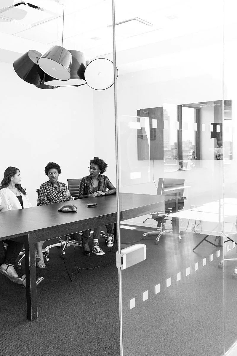 Group of women sitting in the conference room having a meeting