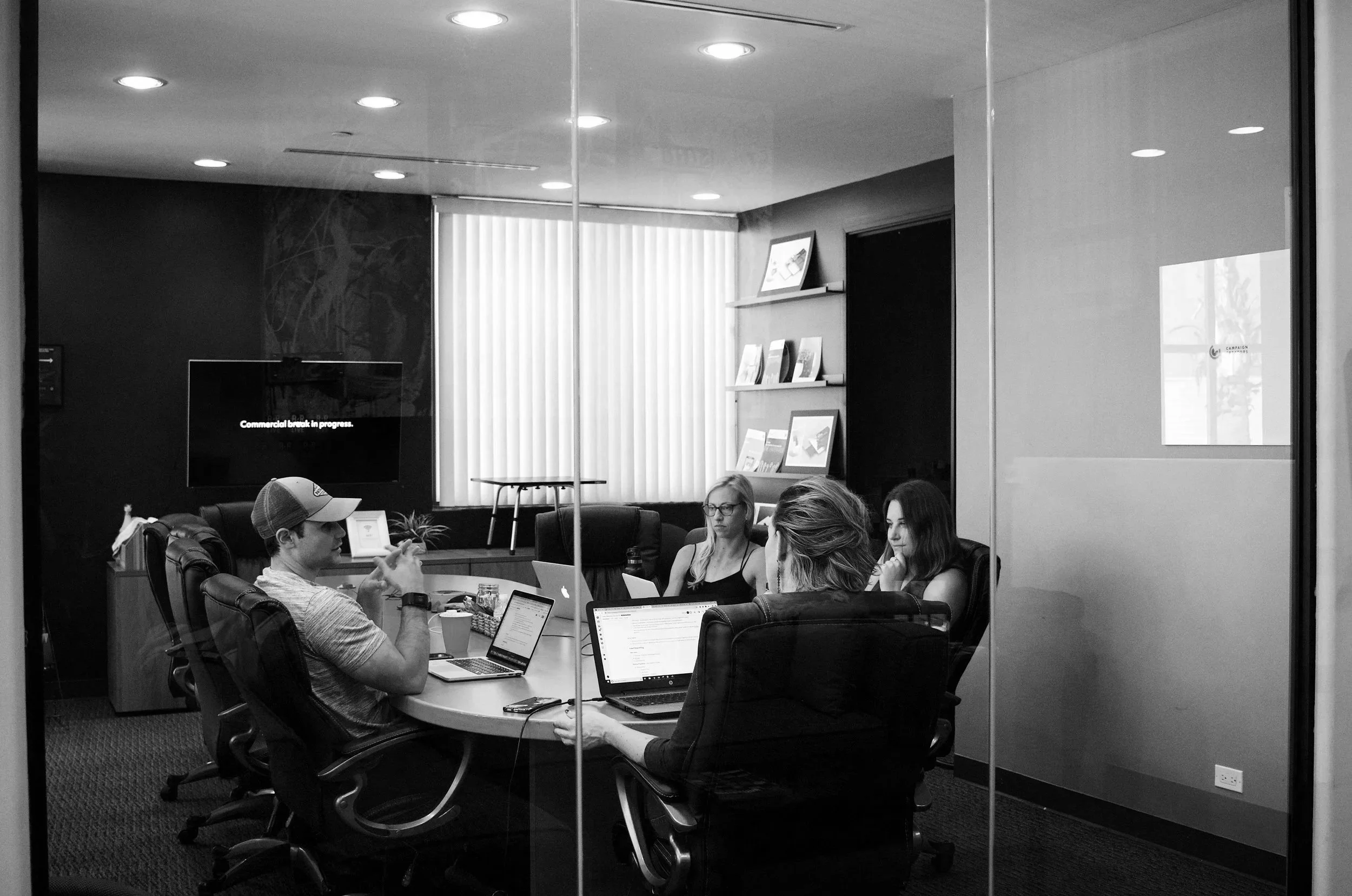 A group of coworkers having a meeting in the conference room