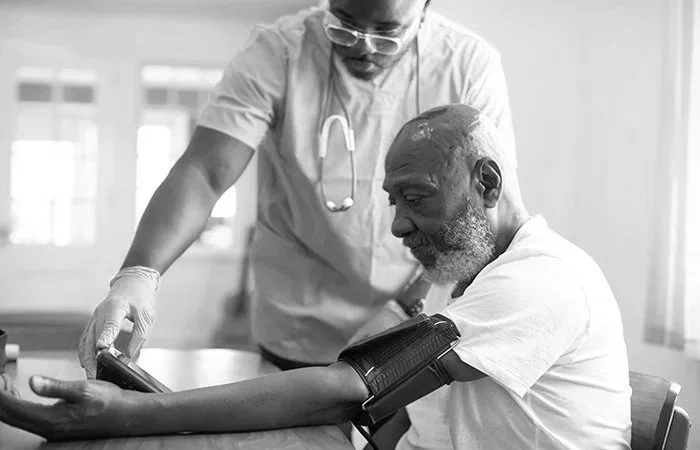Healthcare professional caring for a patient, representing medical practices, clinics, and healthcare organizations improving patient outreach through website design, SEO, and digital marketing.