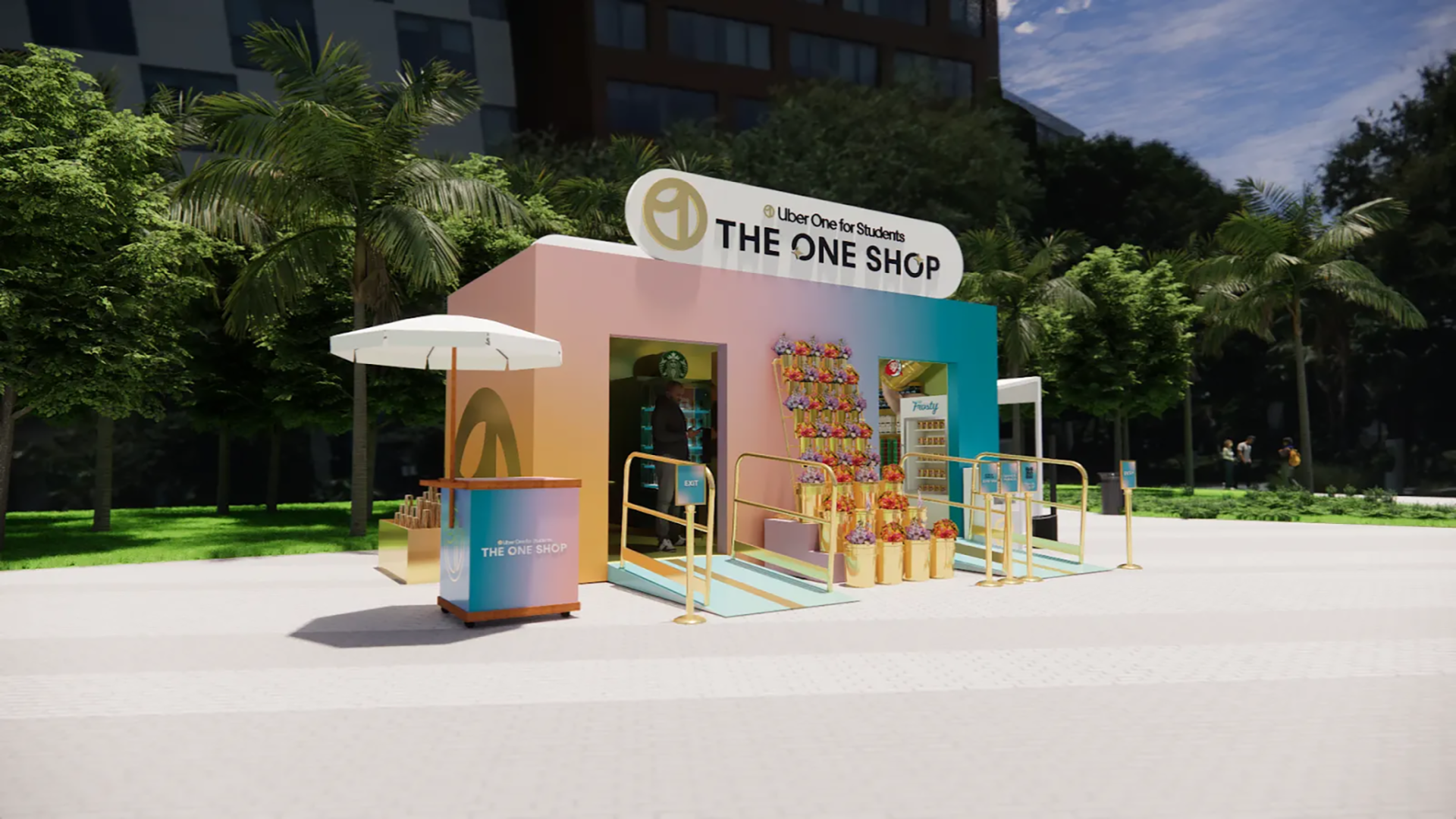 An outdoor colorful shop kiosk labeled 'The One Shop' with a pastel pink and blue facade, gold railings, flower arrangements, a white umbrella, and vending machines, set against a backdrop of green trees and buildings.
