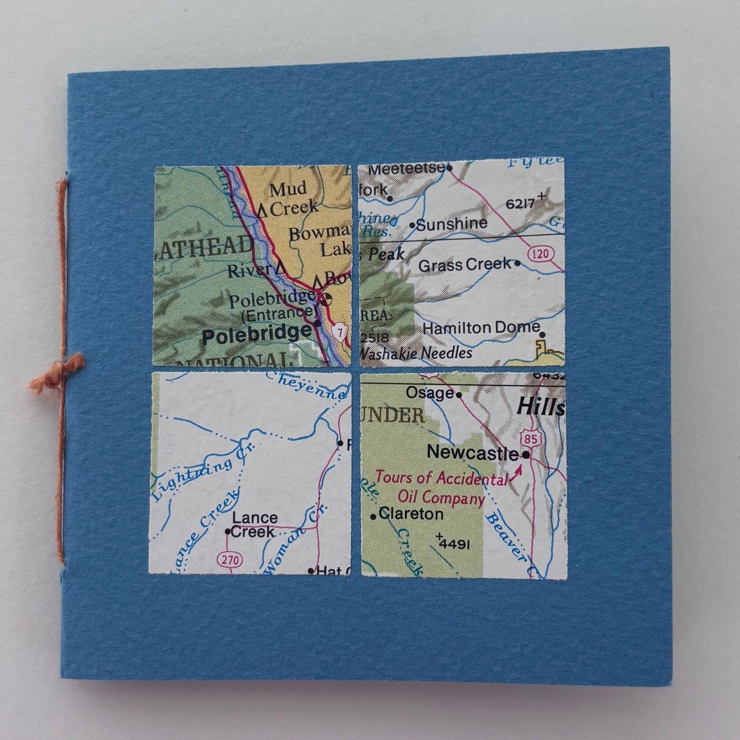 The first link in the Neverending Art Chain! I made this small pamphlet book with mixed papers and decorated with squares from a map. This was sent to the first person to send in a piece of art to my project! #ksartchain