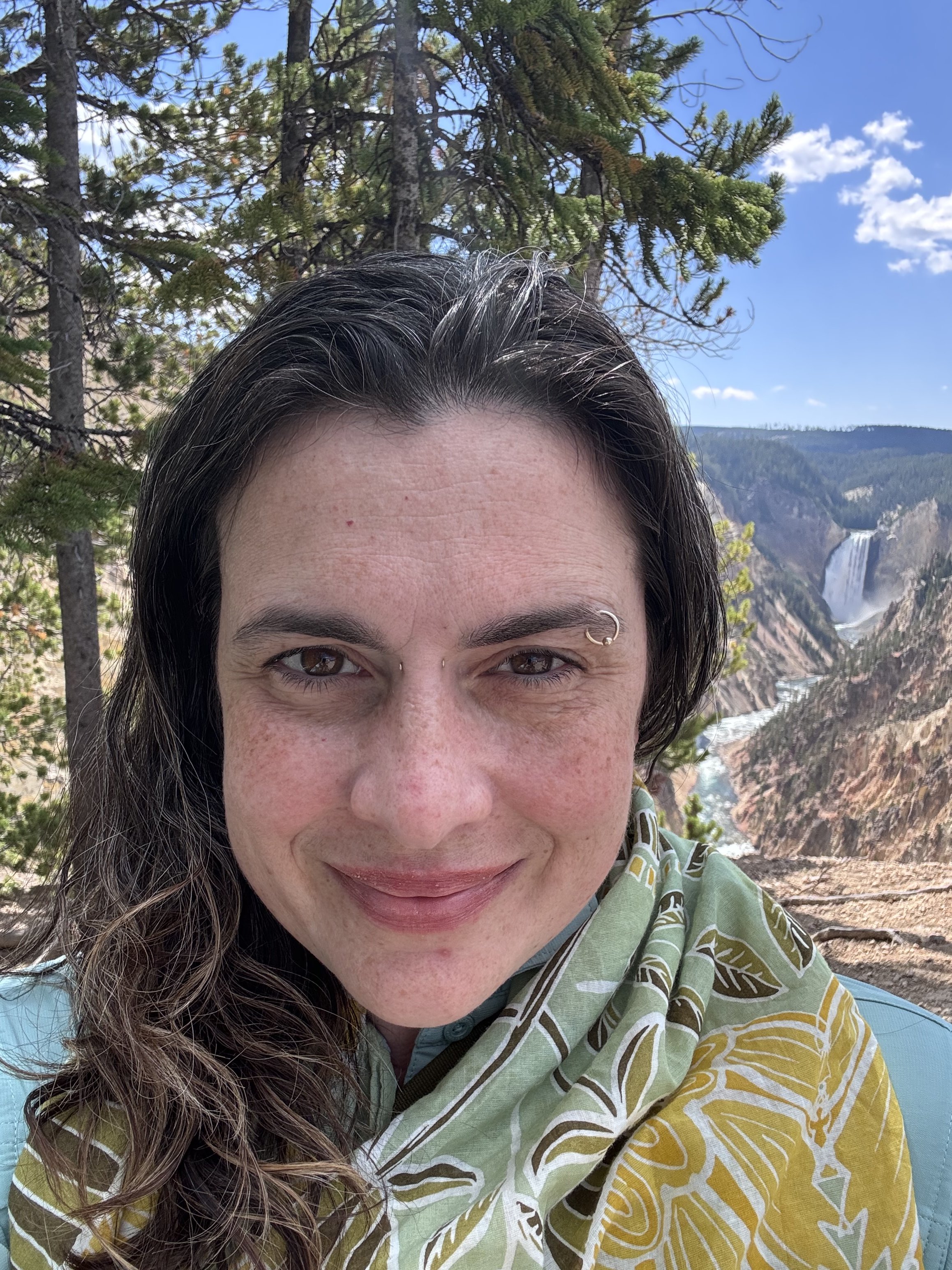 Kate with the Grand Canyon of the Yellowstone in the background