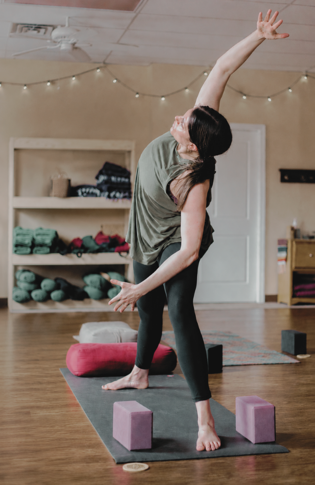 Mel Rolfes practicing a yoga pose at Uttara Yoga Studio.