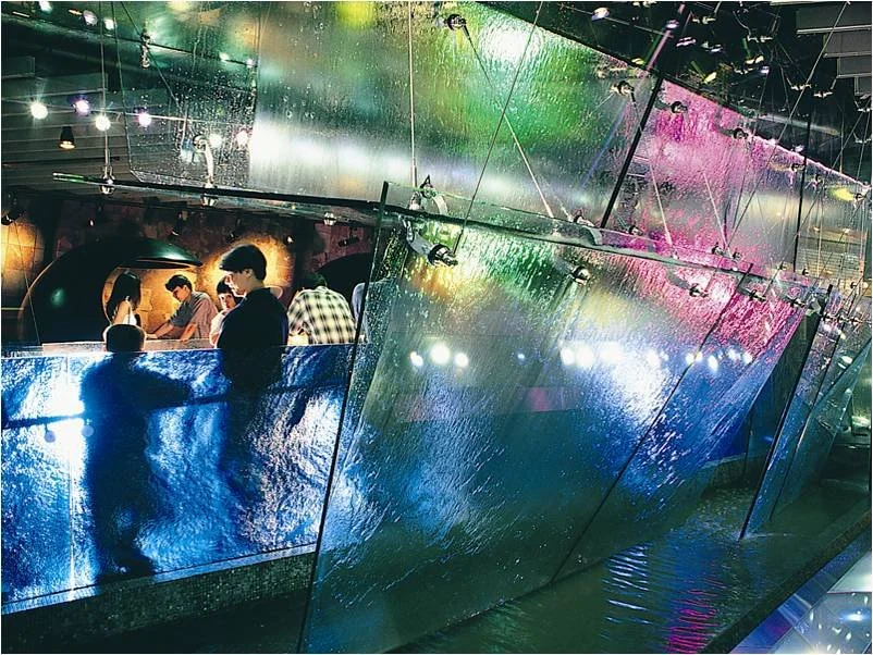Guests began their visit by walking under a water fall flowing over glass suspended by a custom cable system similar to that used in large racing sailboats. 