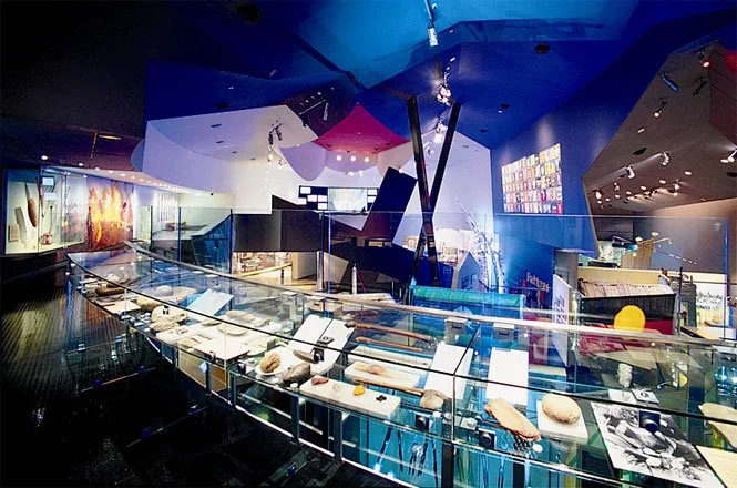 The GAA overlook included glass cases whose artifacts cast shadows and reflections.