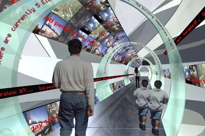 People walking through Digiscura, a futuristic, spiral-shaped corridor filled with multiple screens displaying various images and news updates at the Staten Island Institute for Arts & Sciences Discovery Center.
