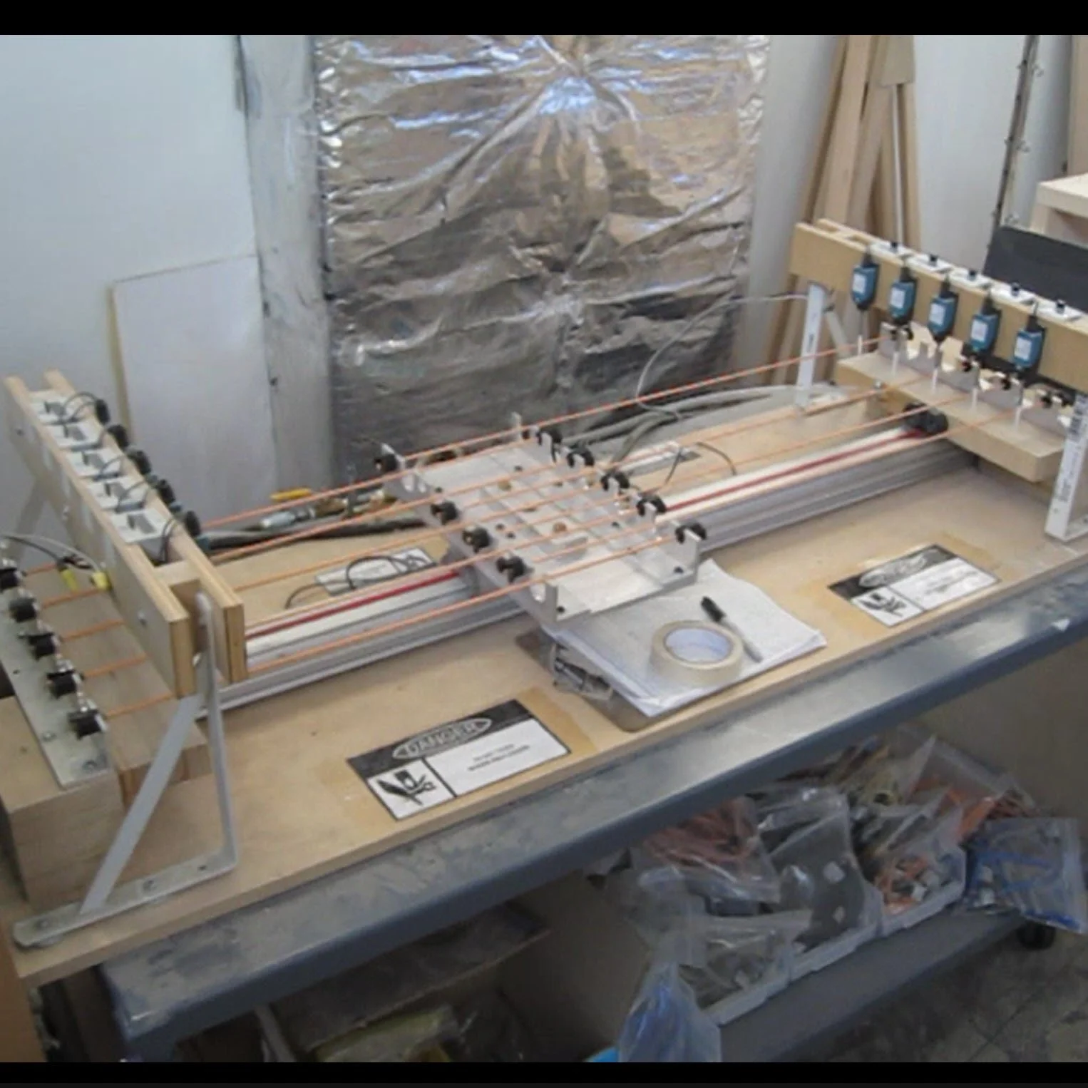 I designed and built this cycle tester to compare lifecycles of different latex band manufacturers, sizes, and many other factors that would have been impossible to test in the field