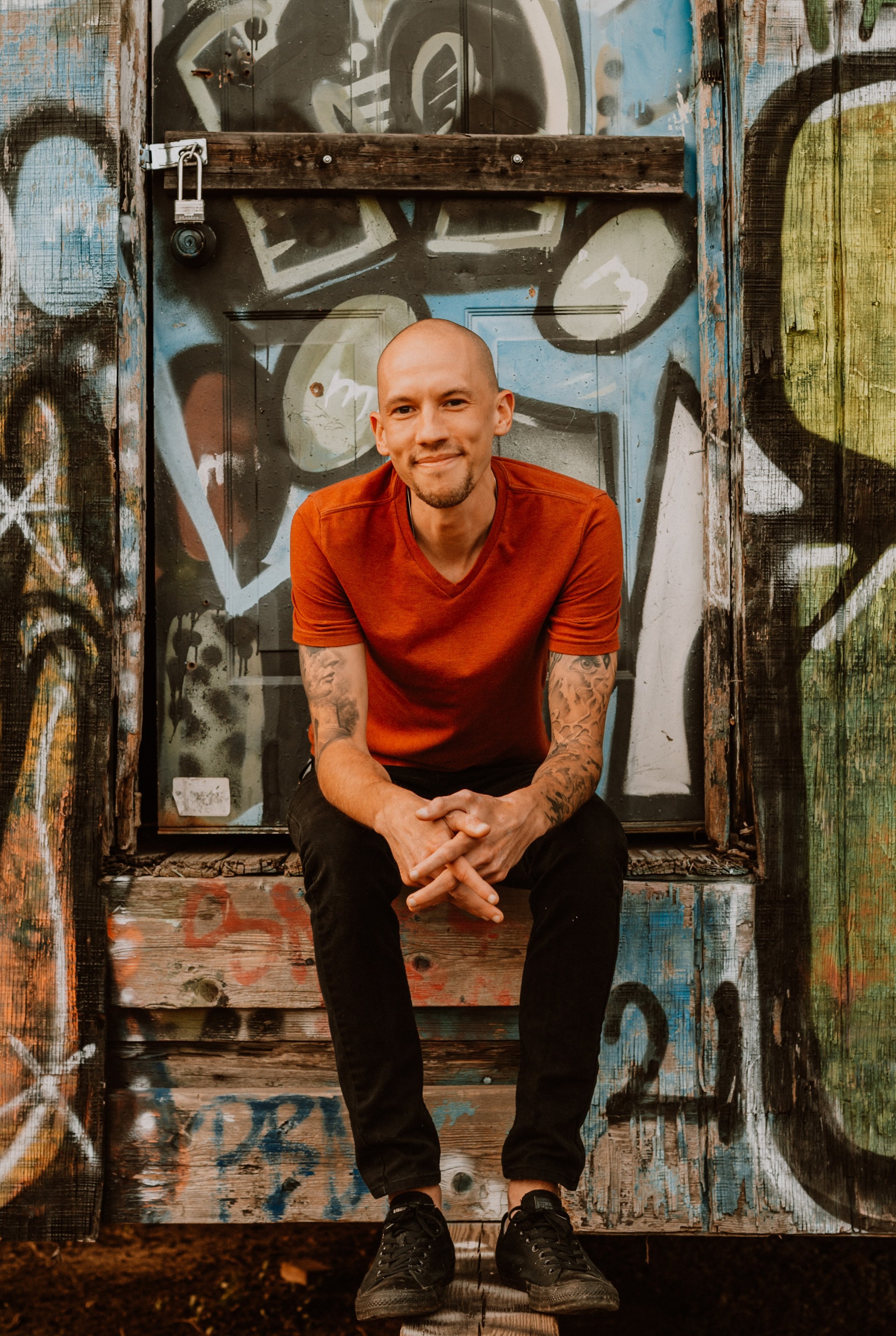 Zack Kampf sitting outdoors, depth psychotherapist and Pacifica faculty