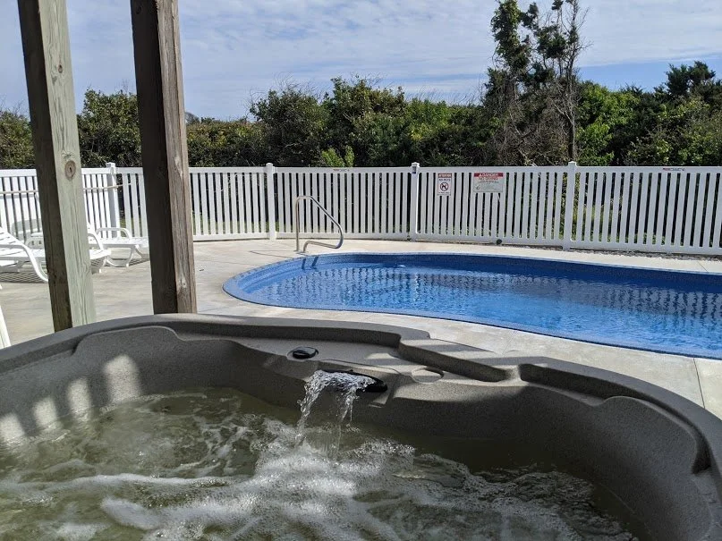 Hot tub and pool open year round attached to the home