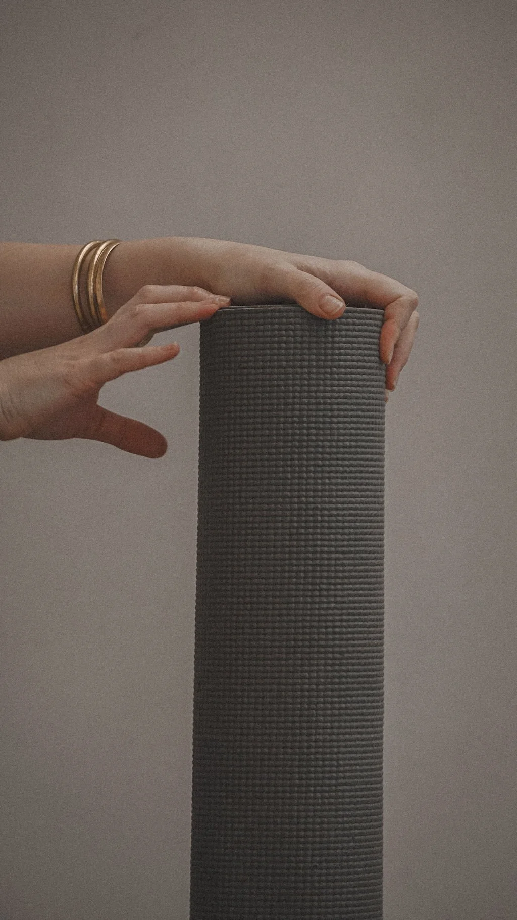 close up of yoga mat and hands