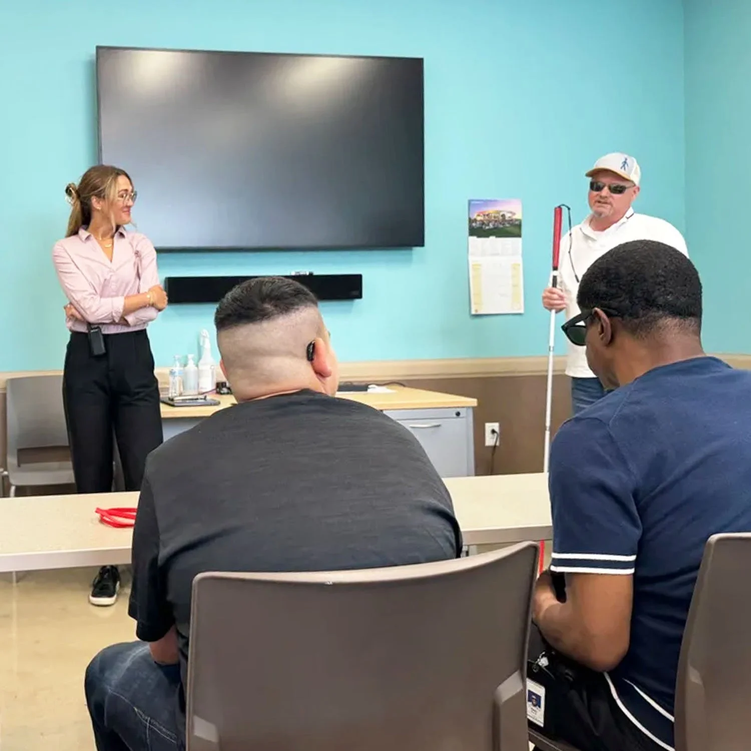 Rick SanJuan teaches on leadership in a group of visually impaired and blind individuals.