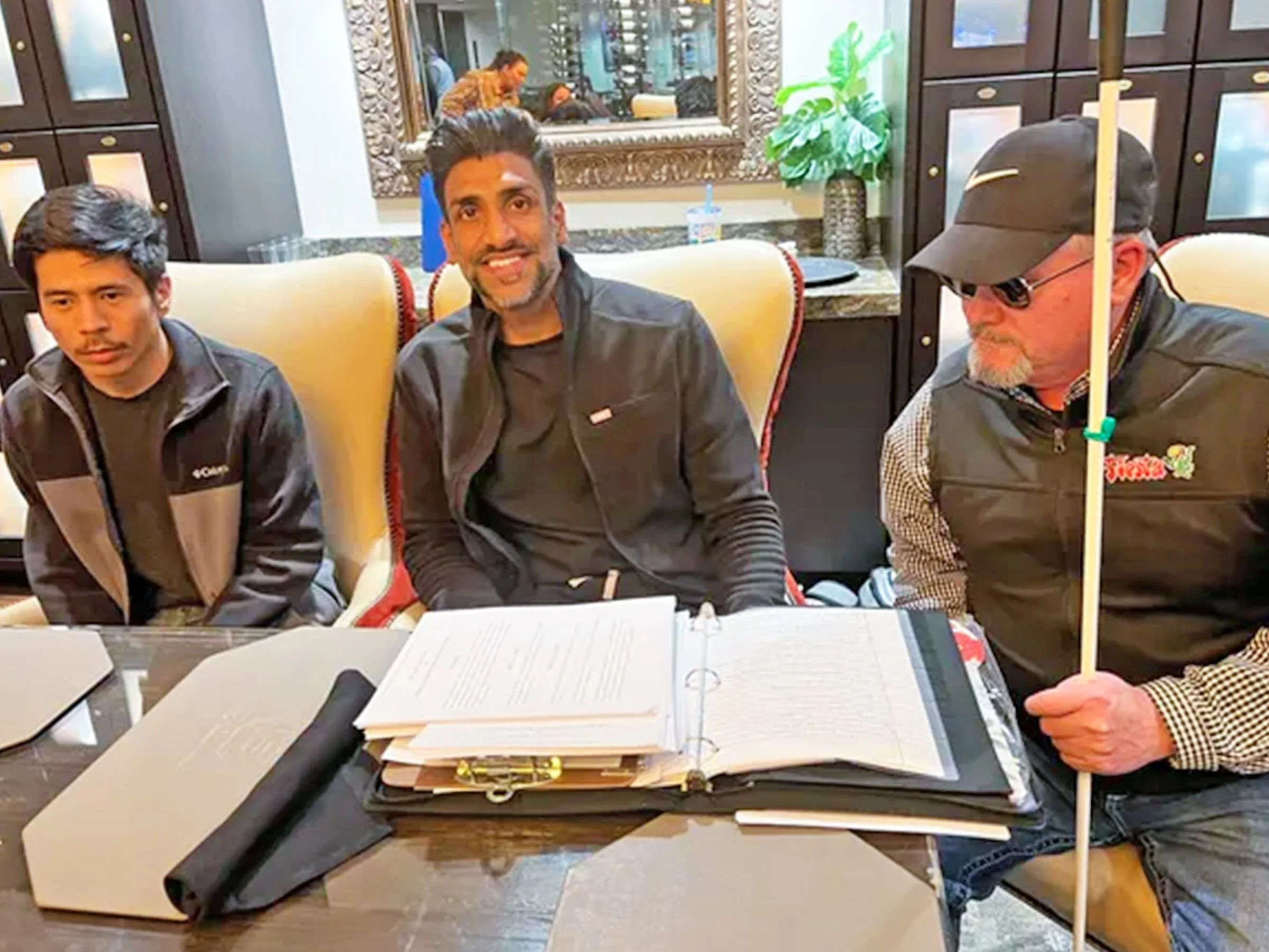 Dr. Danny Matthew, with Eyeworks (middle), sits with Rick SanJuan (right) and Alfredo Garcia (left), working diligently to help local visually impaired and blind communities.