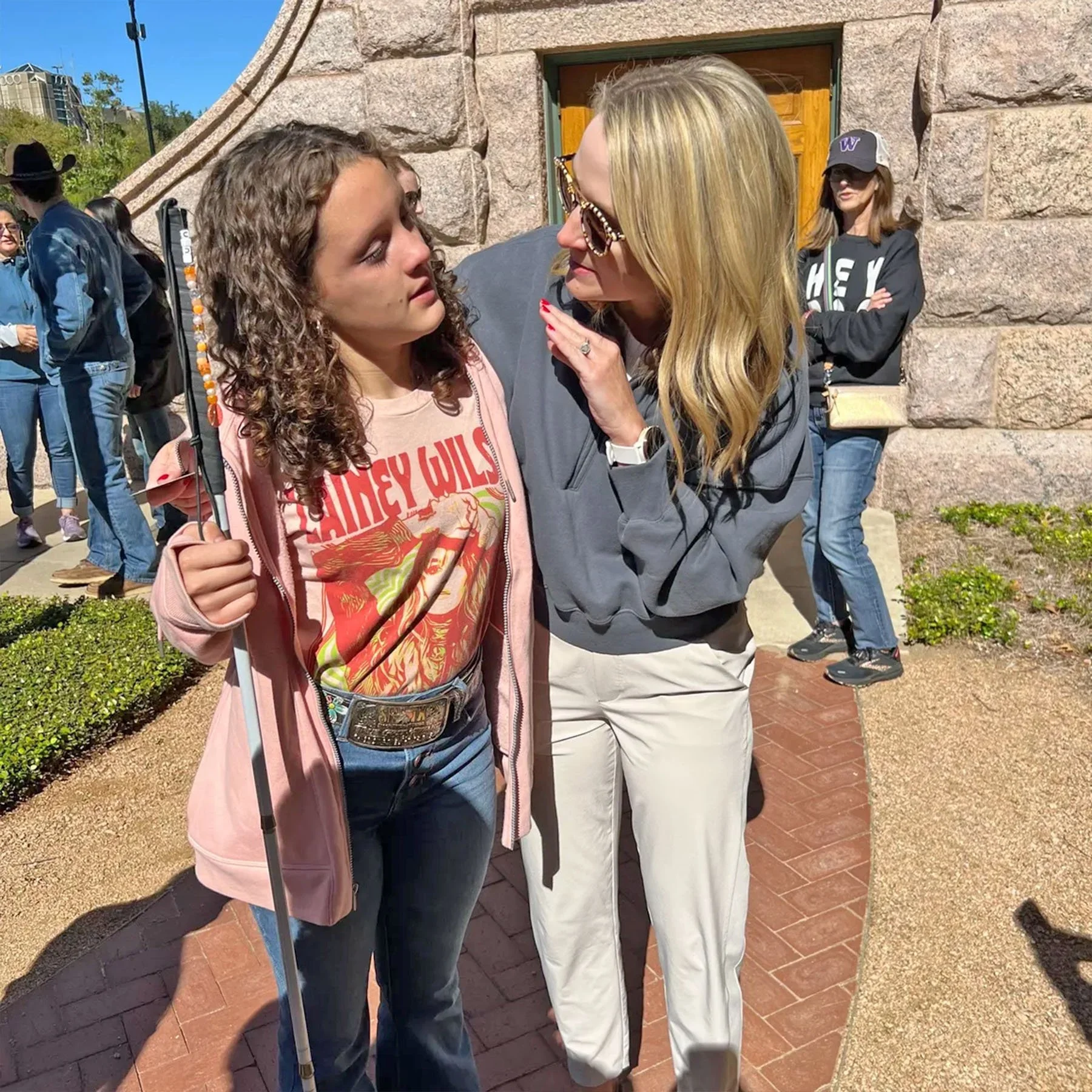 Fort Worth Mayor Mattie Parker (right) hugs and encourages the young Emma Videl on White Cane Day 2023.