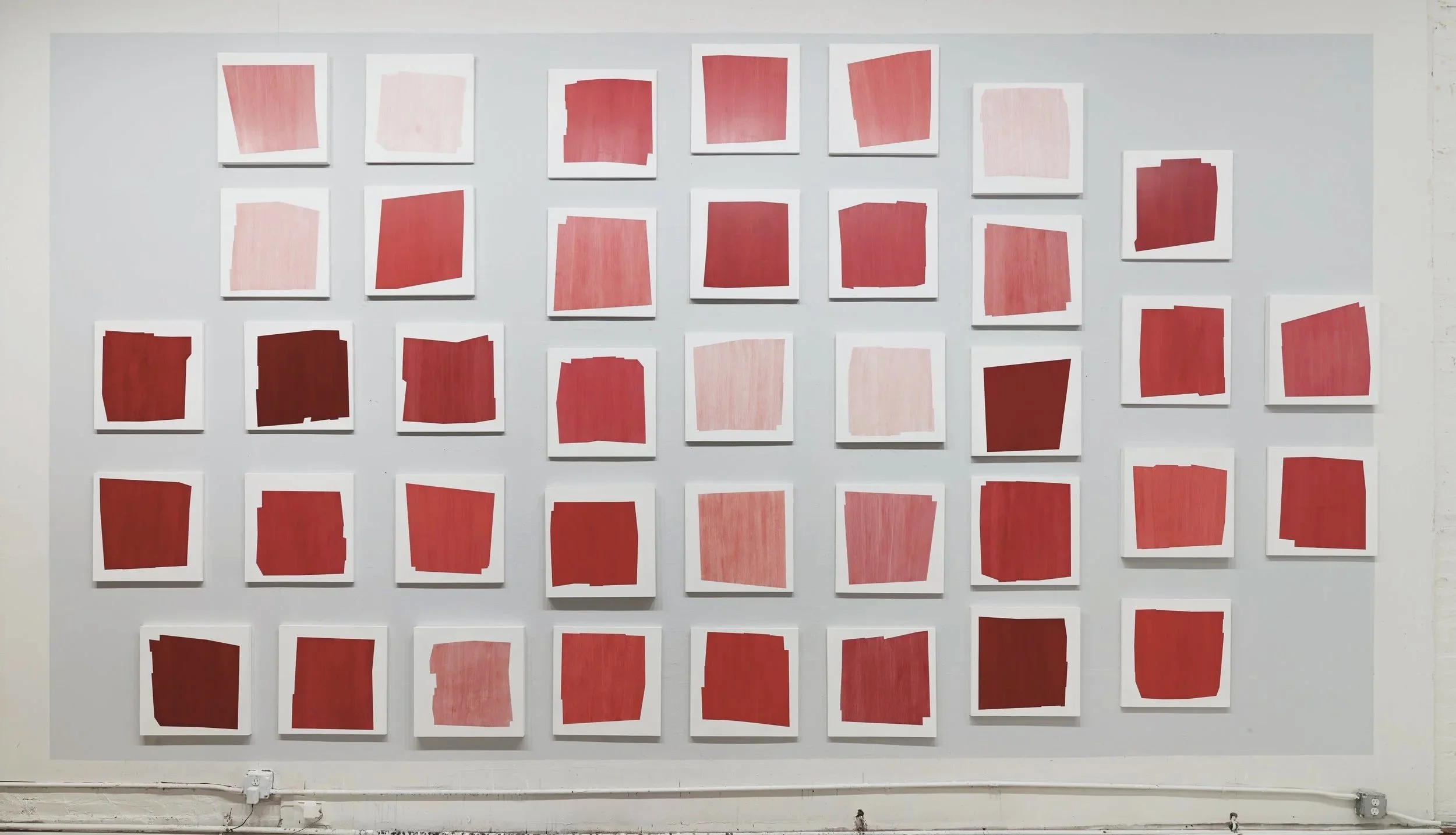 Installation of “A Story of Red” (39 paintings, each 18x18), 2014
