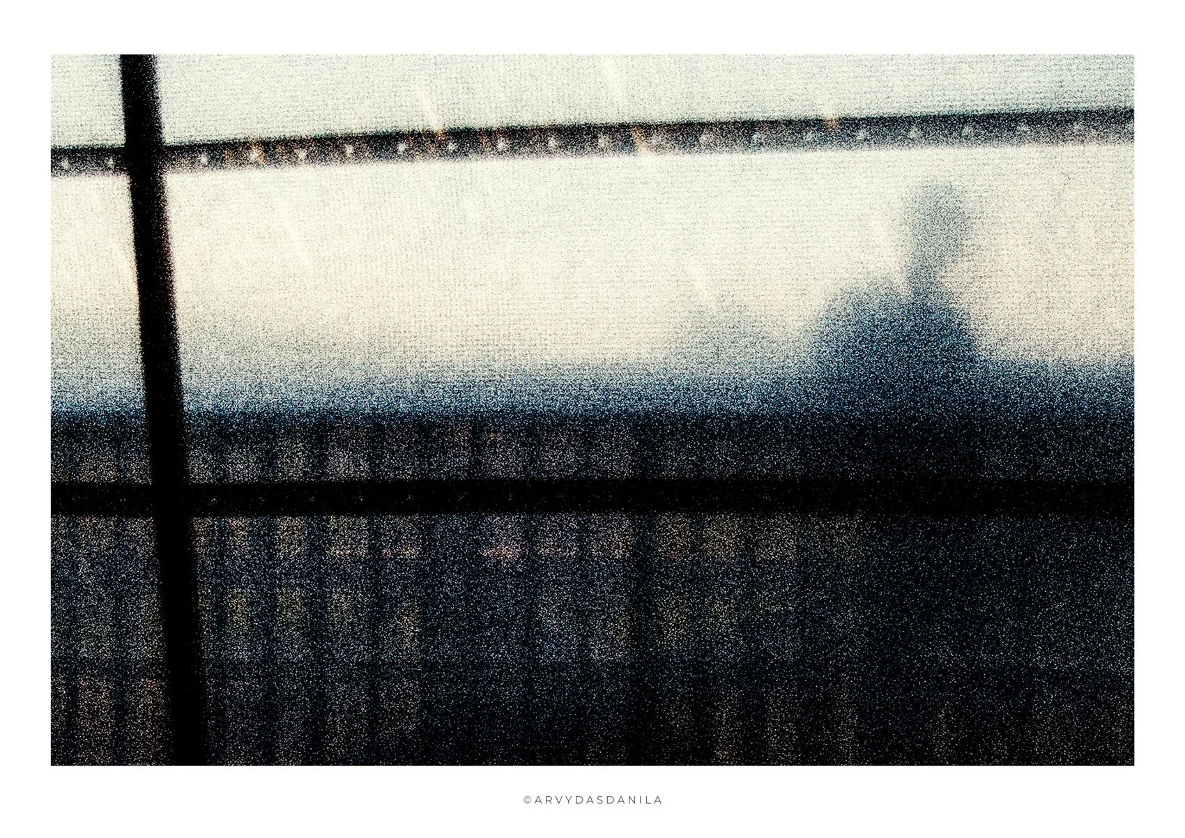 A grainy and textured photo print creates sense of dream or blurred out reality, image with it's own sound and vibration.