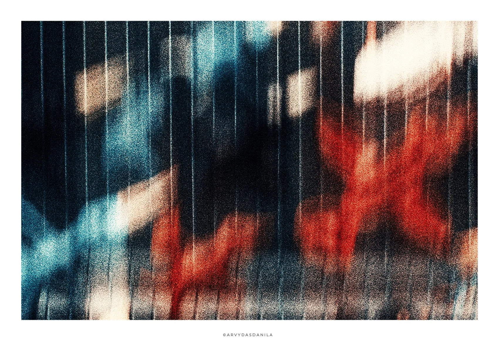 An abstract photo featuring colorful birds taking off, creating a blurred effect with vibrant colors.