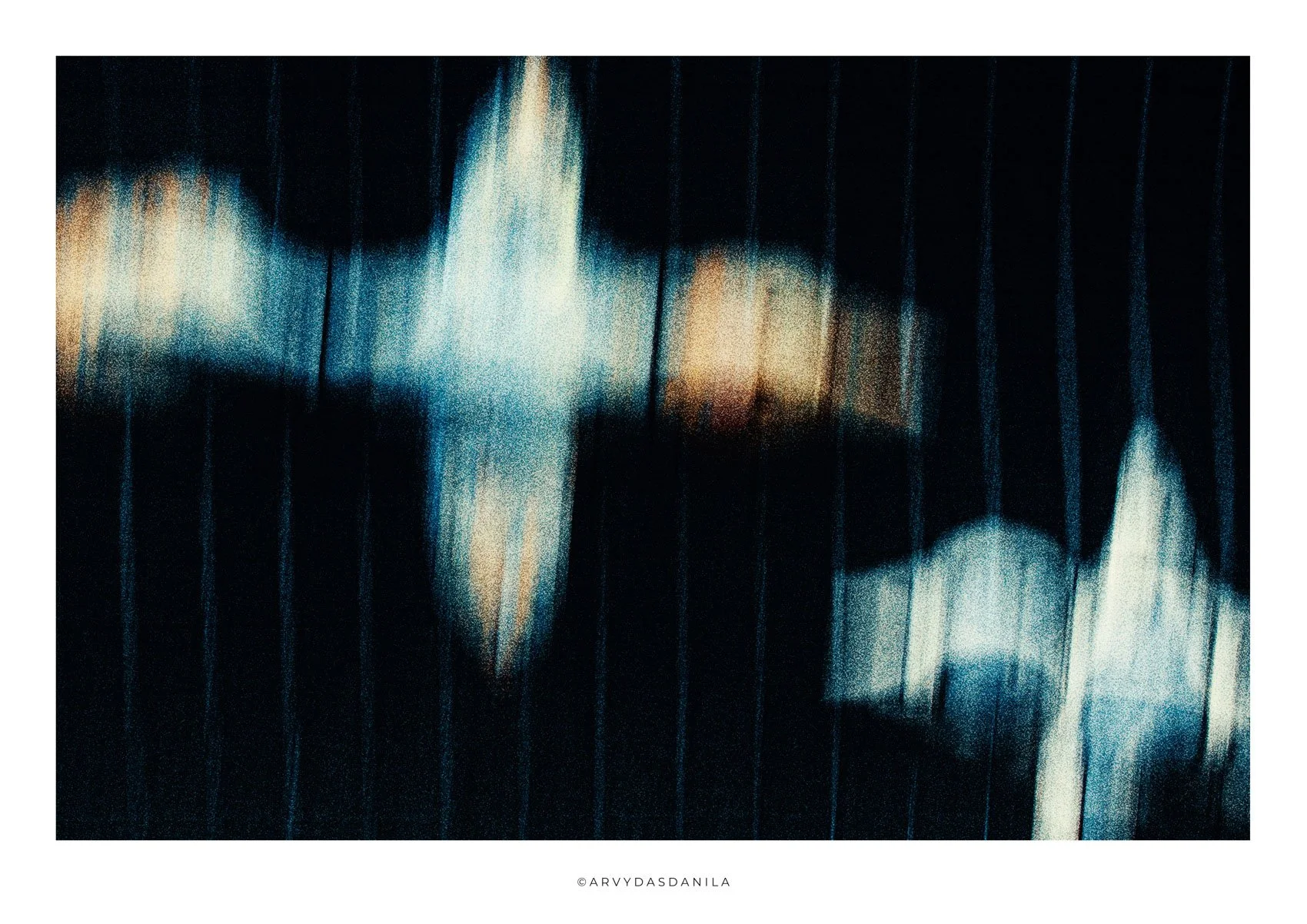 Abstract digital art with vertical lines and blurred light in dark blue and black tones.