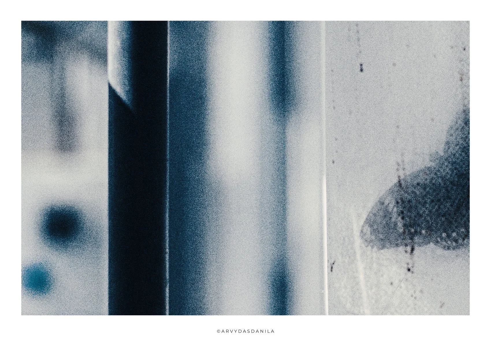 Abstract artwork in shades of blue, white, and black with a textured appearance and geometric shapes and a fraction of a blurred butterfly behind dirty curtain.
