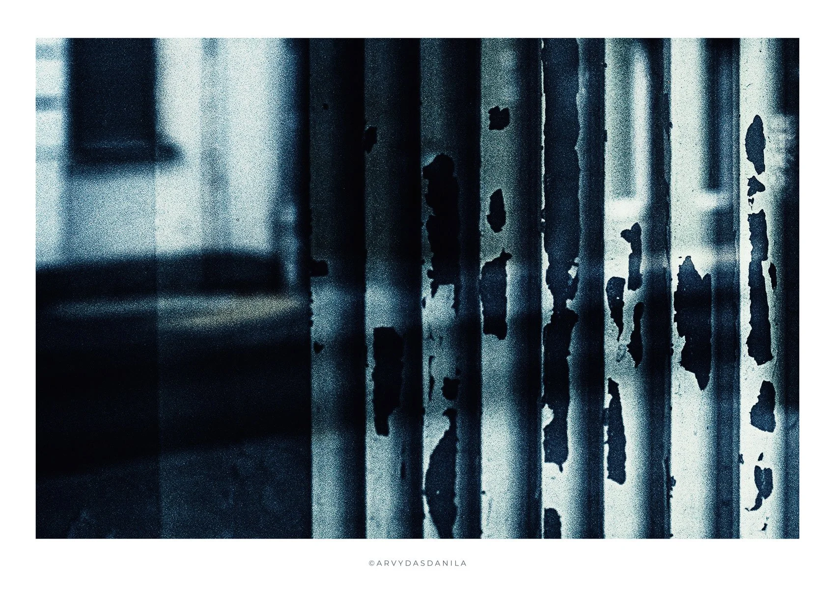 Close-up of weathered, peeling metal structure reflection of a street photo is strong unusual and standing out total eye catcher  in shades of blue and black.