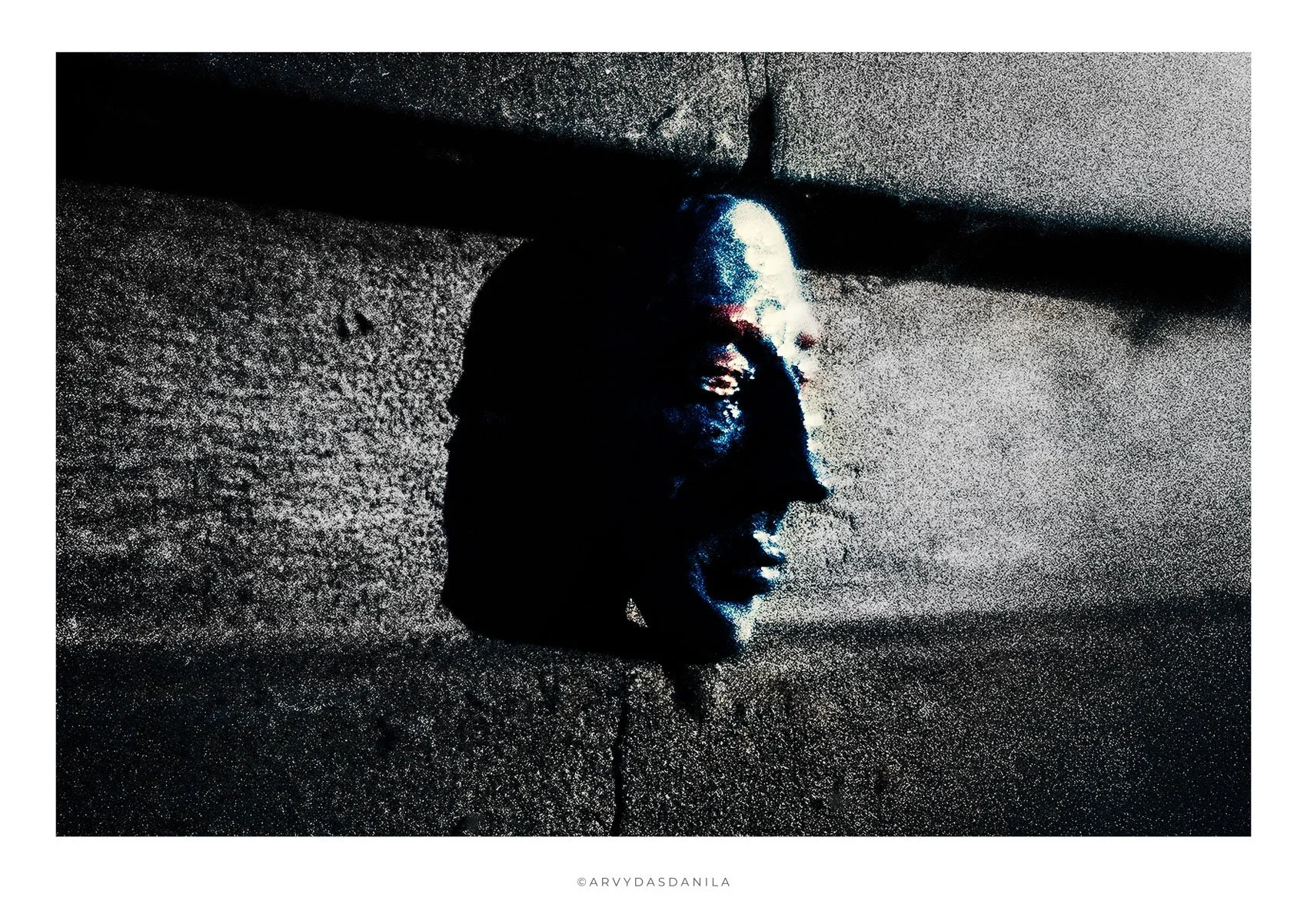 abstract and unusual artistic photograph sculpture watching the world rough grainy technique monochromatic with some blue and red accents.