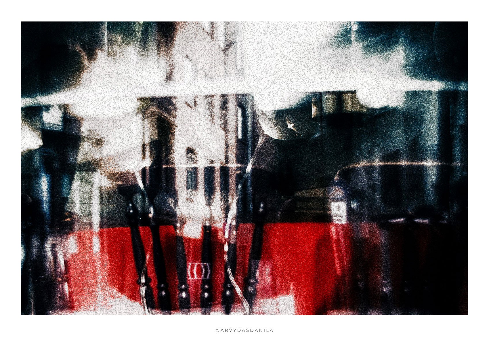 Surreal abstract photograph depicting vision of a town obstructed by shapes and bursts of light .