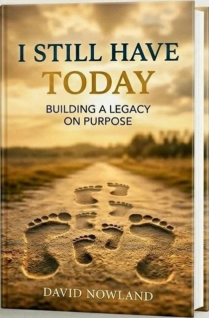 Book cover titled 'I Still Have Today: Building a Legacy on Purpose' by David Nowland, featuring footprints on a sandy path with a sunset background.