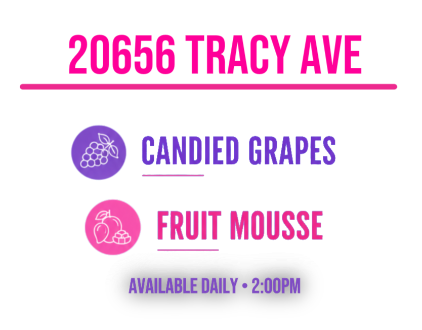 A sign displaying a special dessert of the day: candied grapes and fruit mousse, available daily at 2:00 PM.
