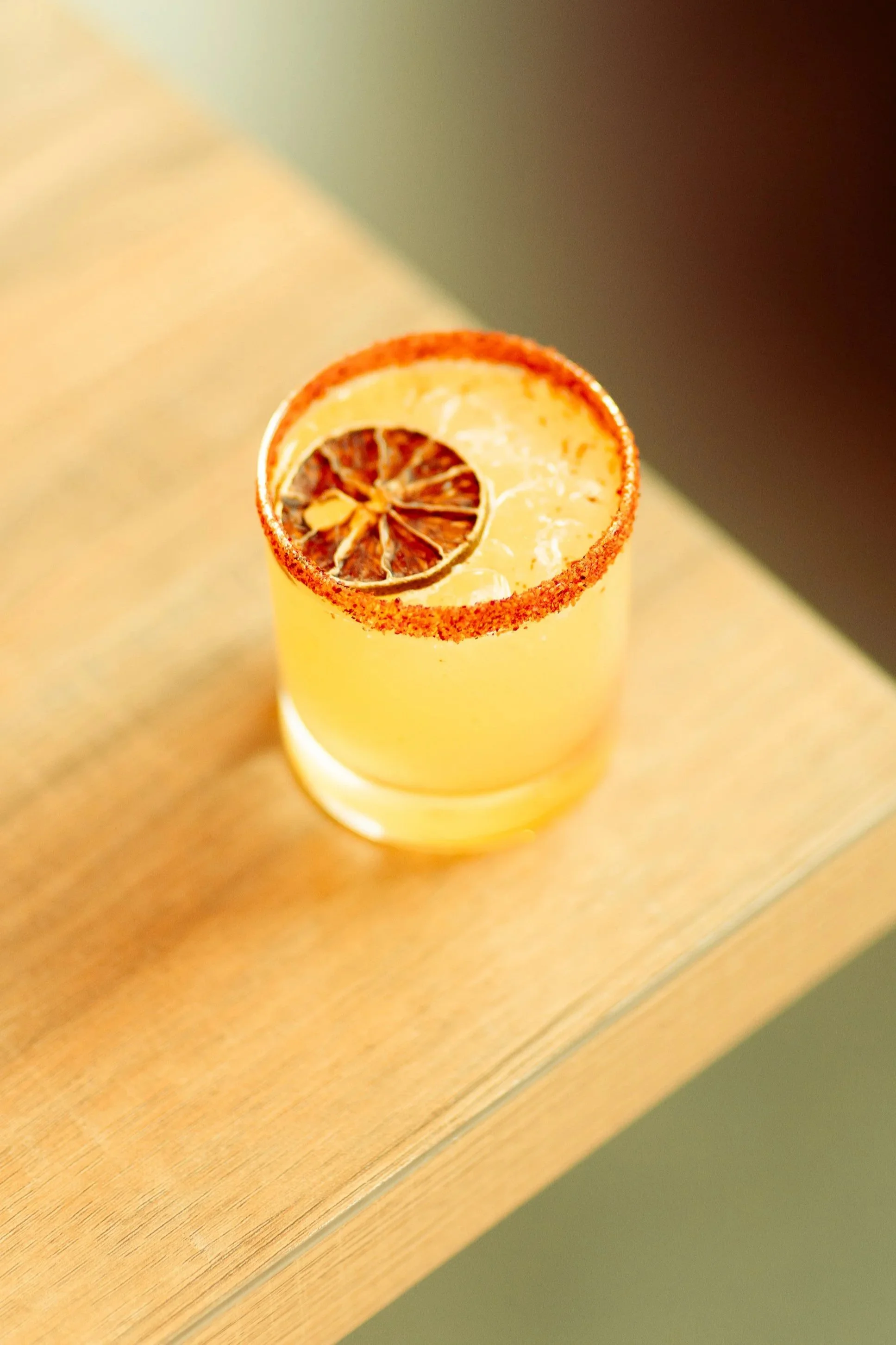 Mezcal, triple sec, lime juice, jalapeño syrup