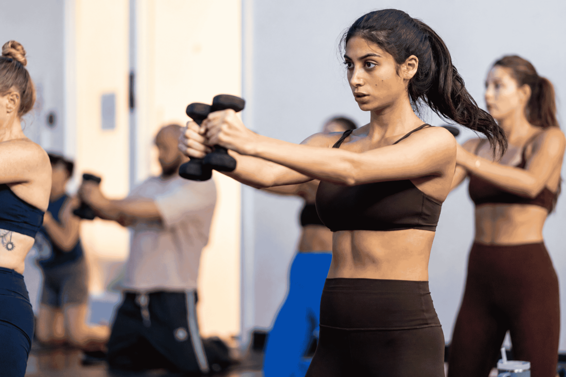 woman breaking a sweat during class at Yoga Pod Tucson