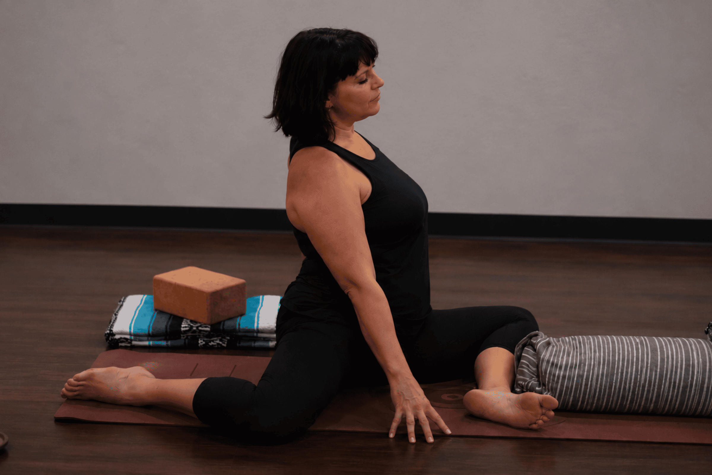 Student practicing Yin Yoga with props at Yoga Pod Tucson