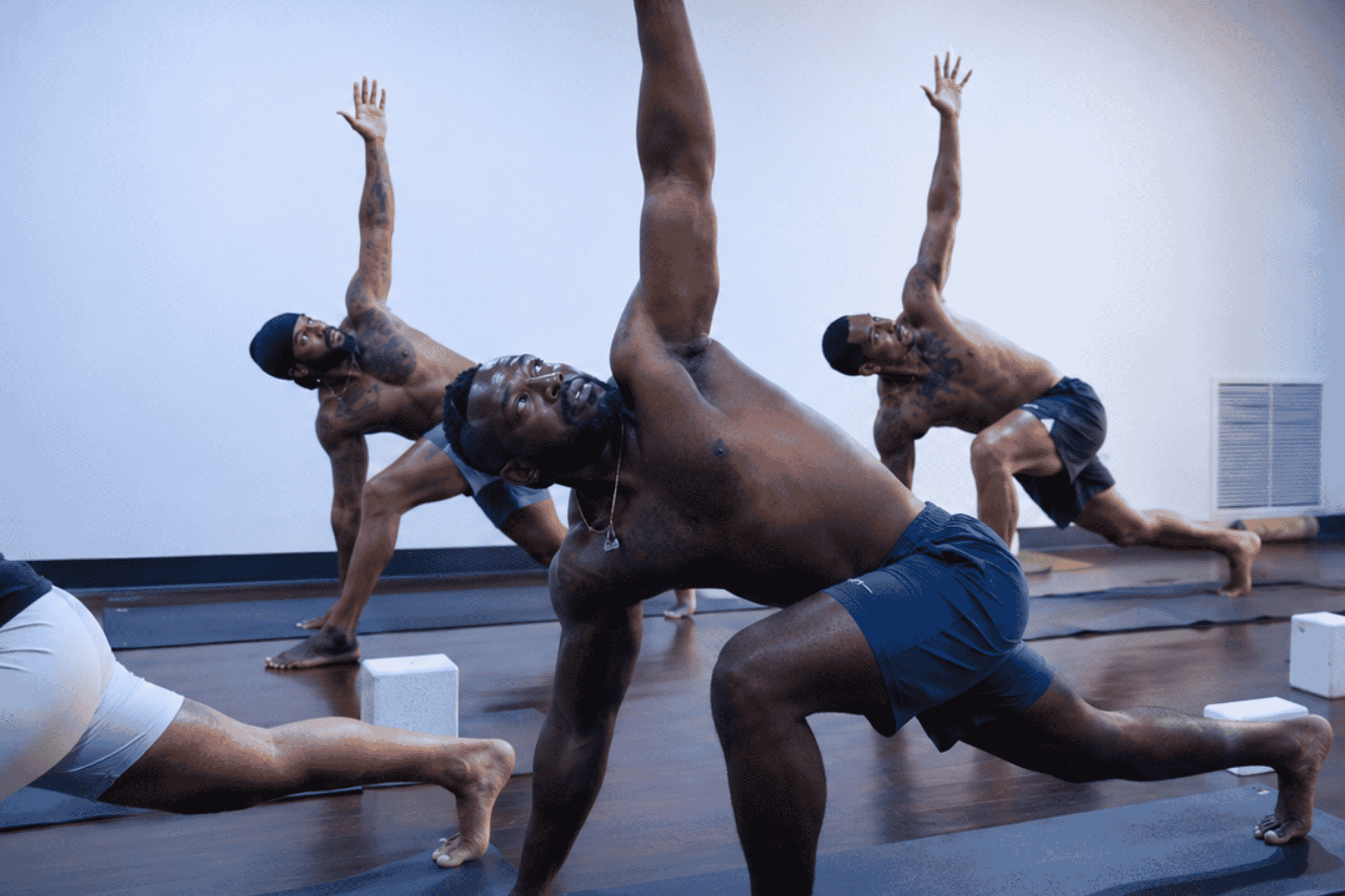men practicing yoga at Yoga Pod Tucson