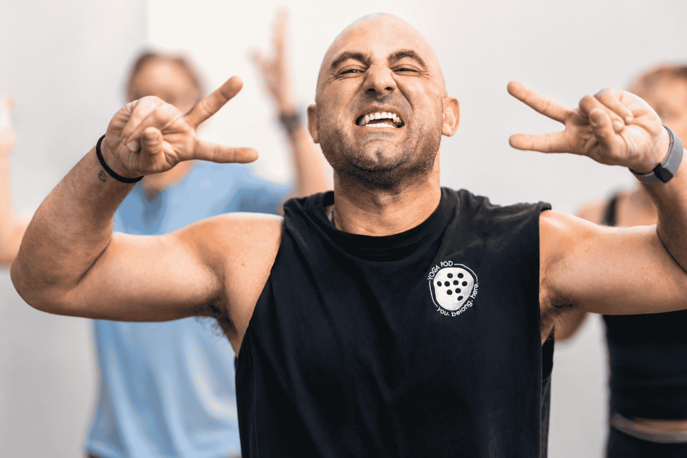 man happy to be in class at Yoga Pod Tucson