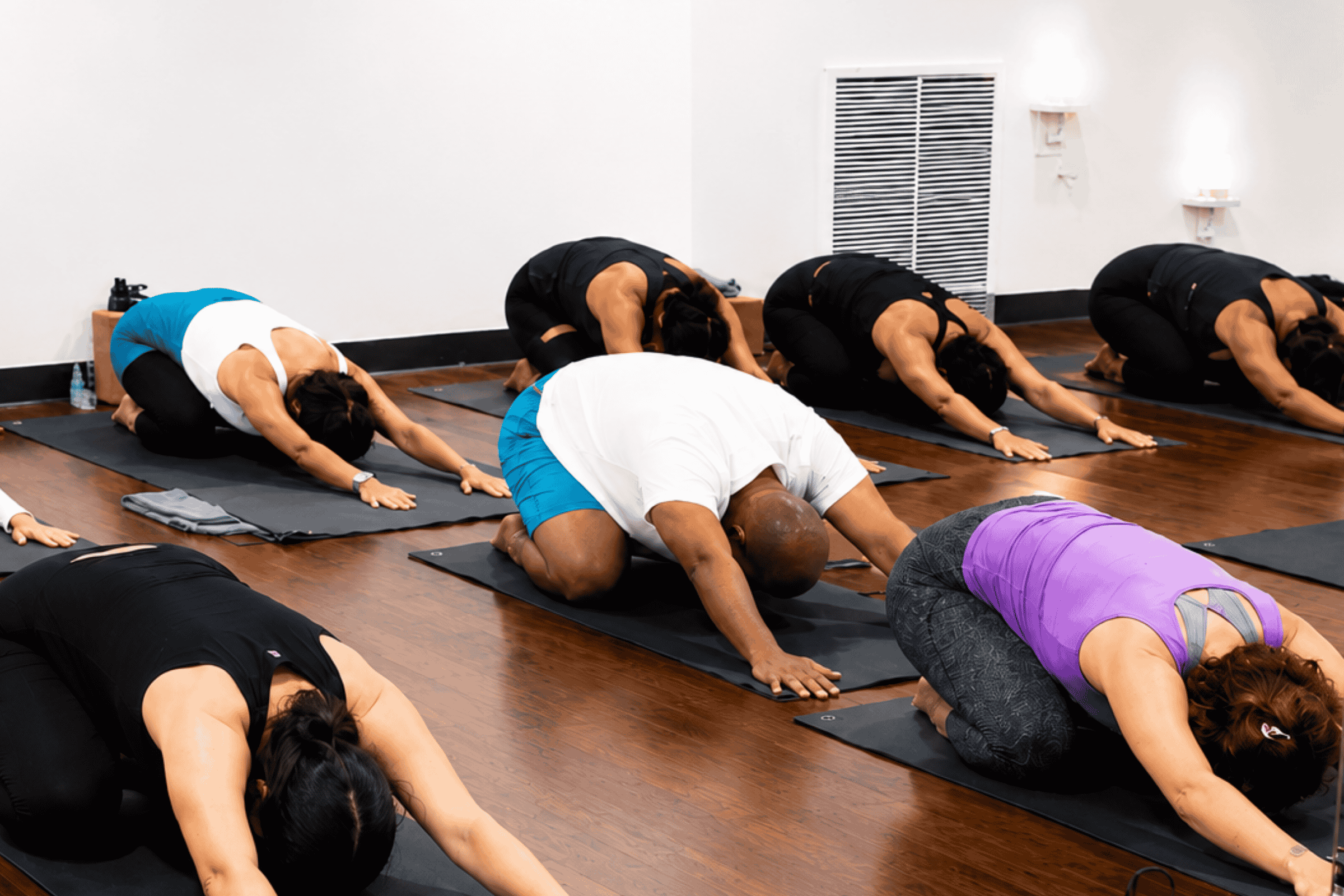 class in child's pose at Yoga Pod Tucson