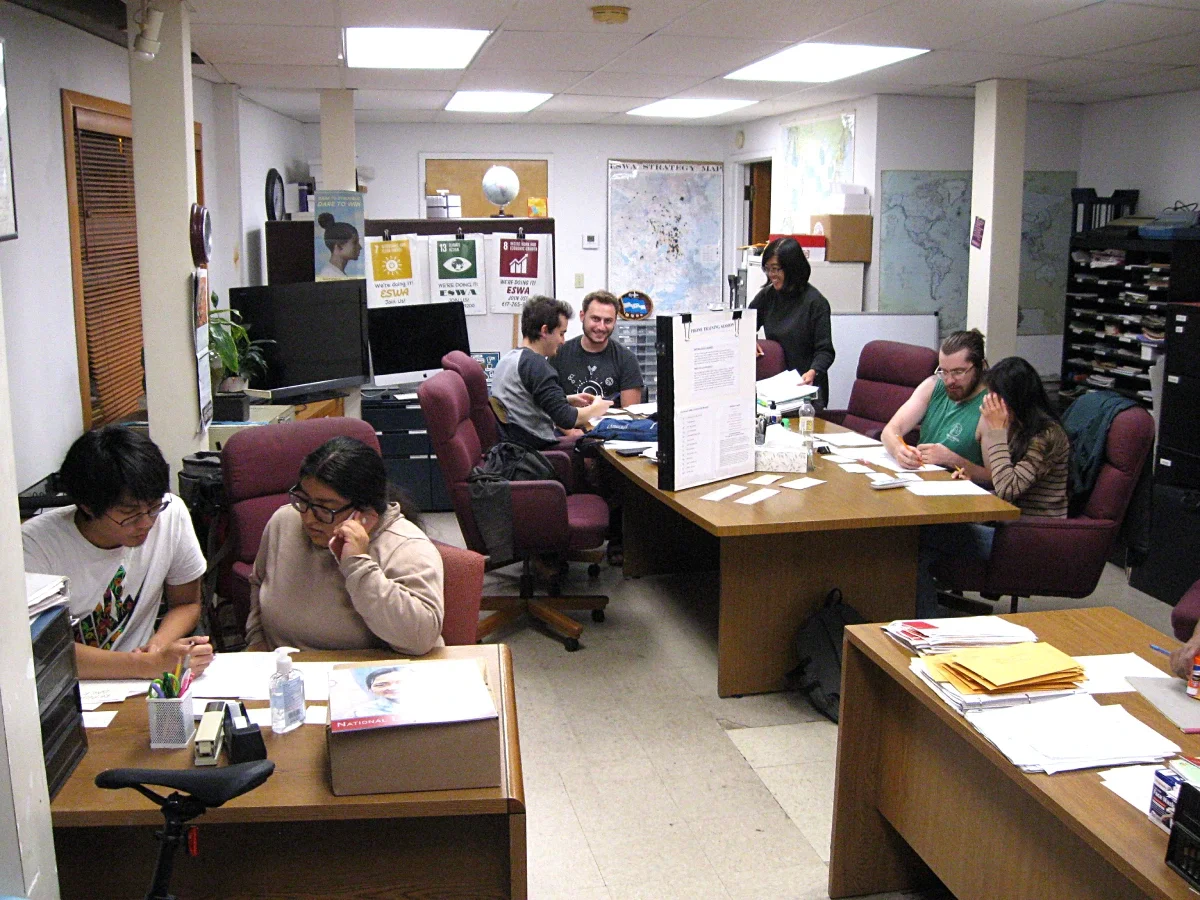 ESWA volunteers phoning in three groups of two, with a trainer and trainee in each group.